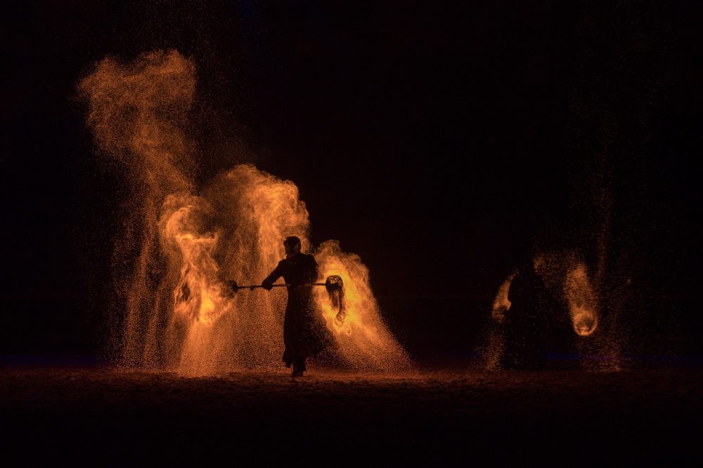 Dancing with fire. Part of the arena show.