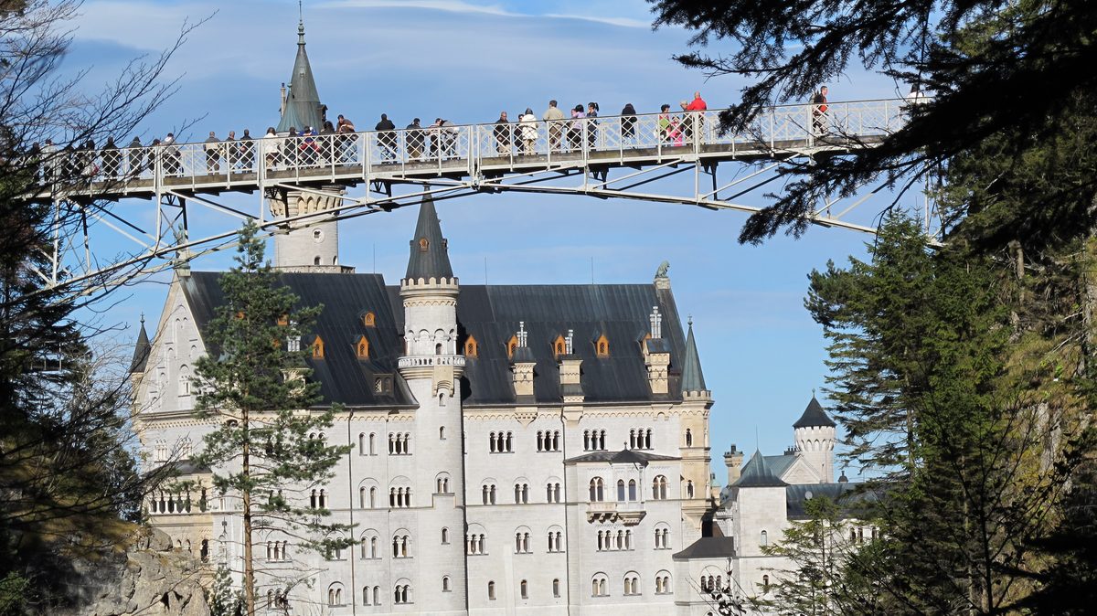 Neuschwanstein Castle seen from below with the Marienbruecke above