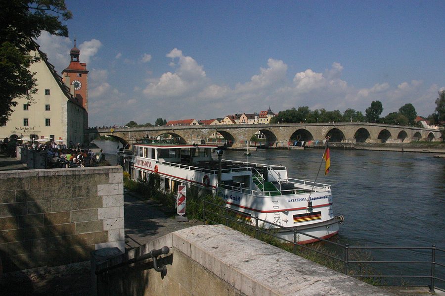 stone bridge and danube boat