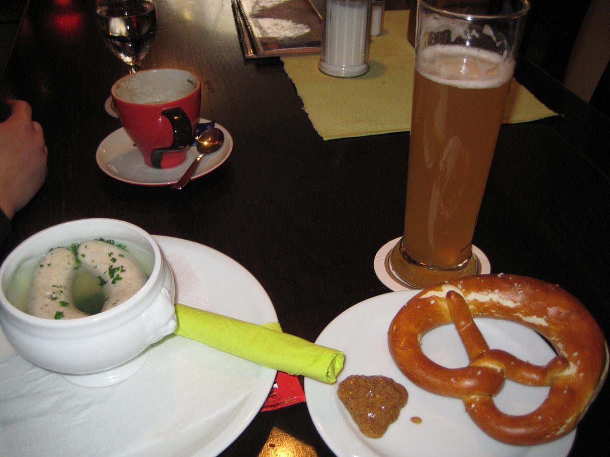 Weisswurst breakfast with Weissbier and a pretzel in Munich