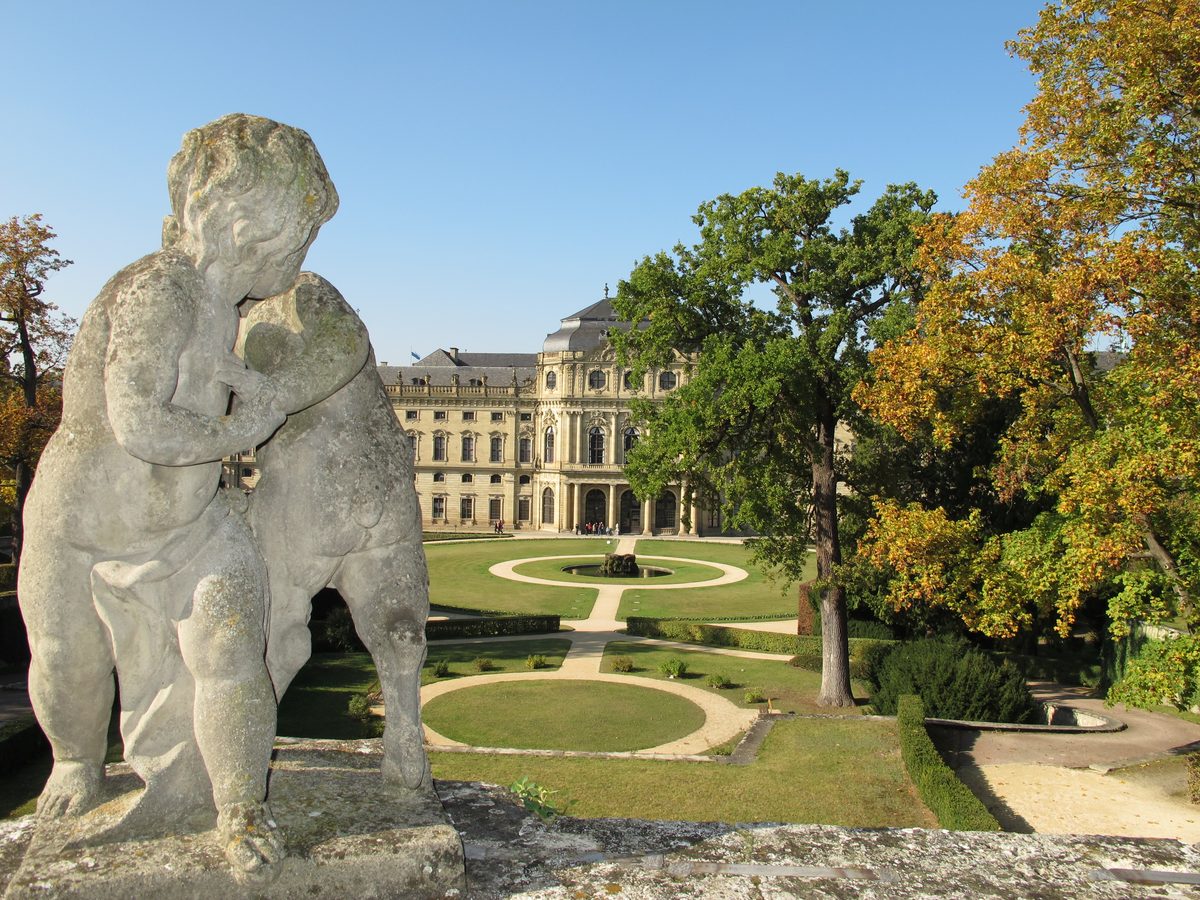 Stone putto statue with the Wurzburg Residenz behind